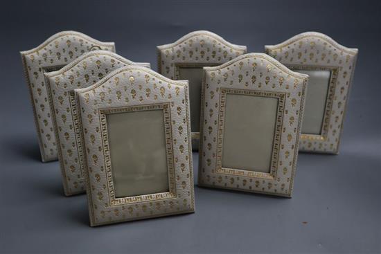 Six embossed leather frames, c.1920, height 16.5cm